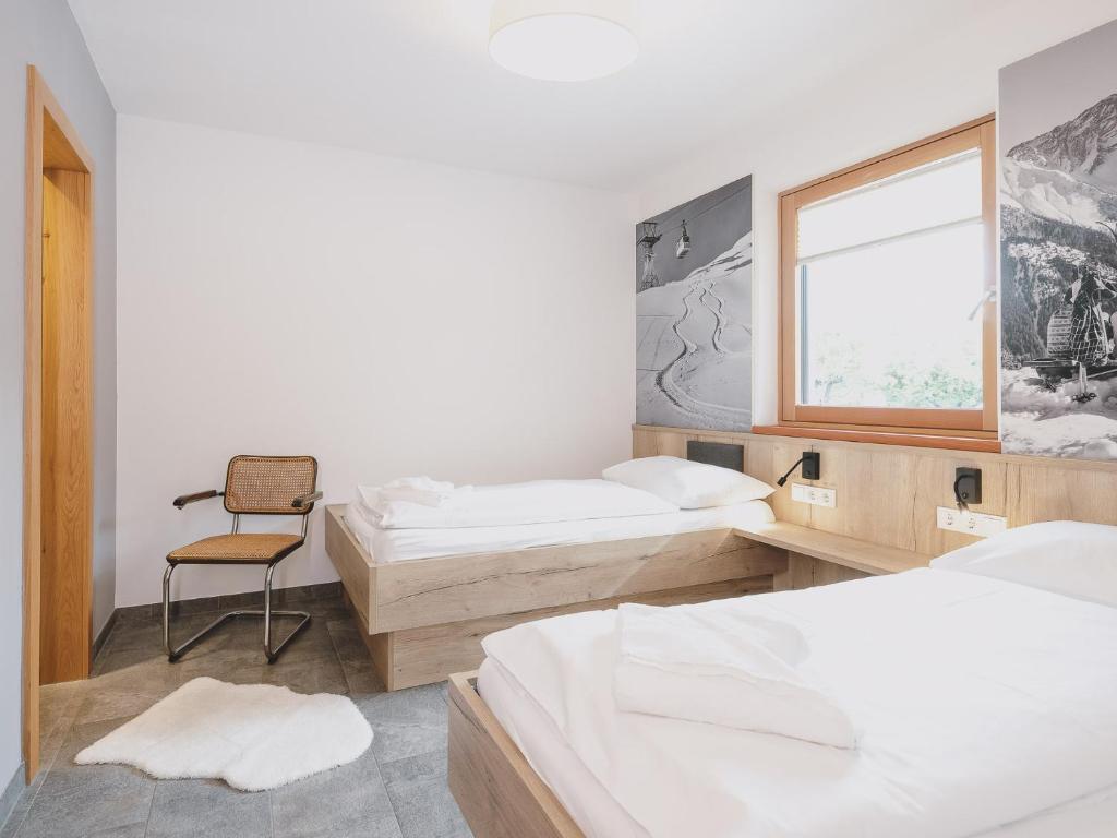 Posteľ alebo postele v izbe v ubytovaní First IN Mountain Chalets by we rent