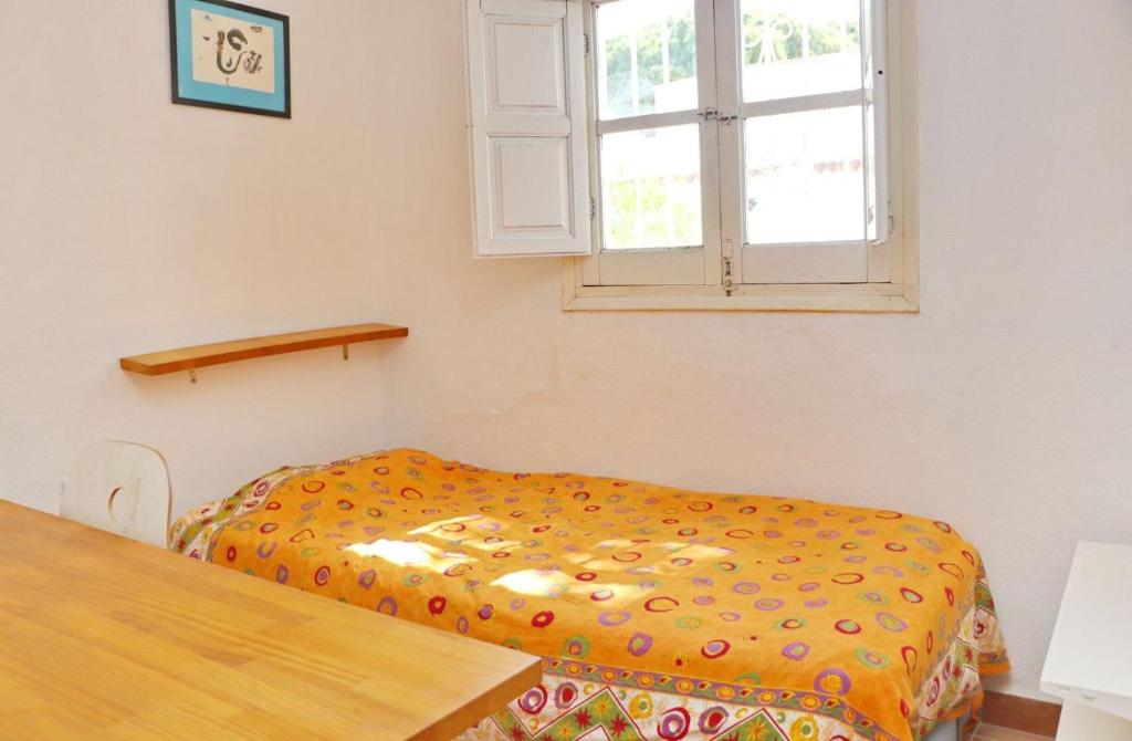 Postel nebo postele na pokoji v ubytování La Casa Andaluza