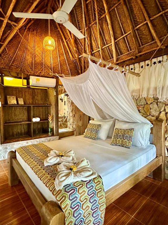 Letto o letti in una camera di Eco Hostal Yuluka