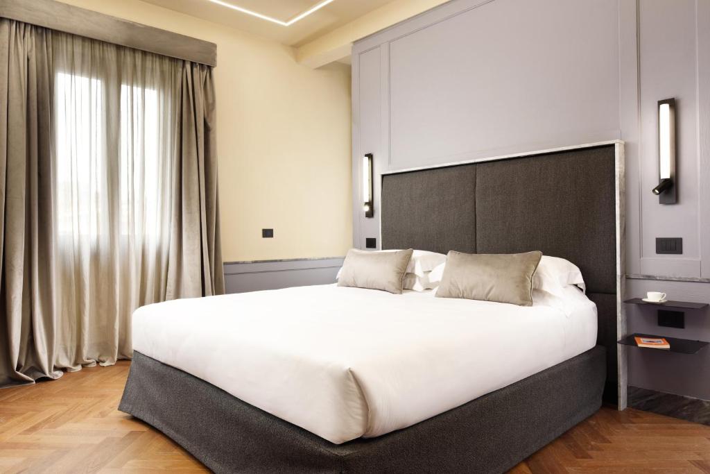 Postel nebo postele na pokoji v ubytování Floren Hotel