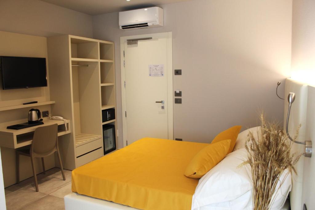 Postel nebo postele na pokoji v ubytování B&B Primrose Residence Hotel