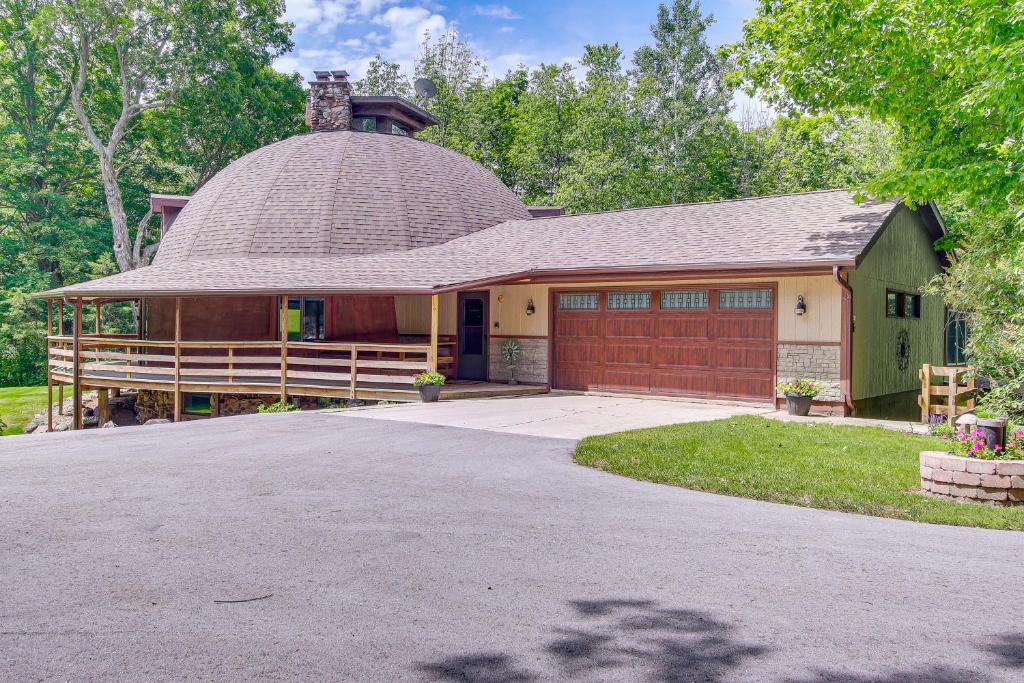 a house with a gambrel roof and a garage at Wisconsin Vacation Rental 1 Mi to Road America! in Plymouth