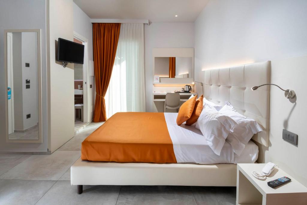 Postel nebo postele na pokoji v ubytování B&B Primrose Residence Hotel