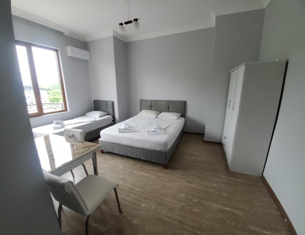 Rúm í herbergi á Elite Hotel Kobuleti