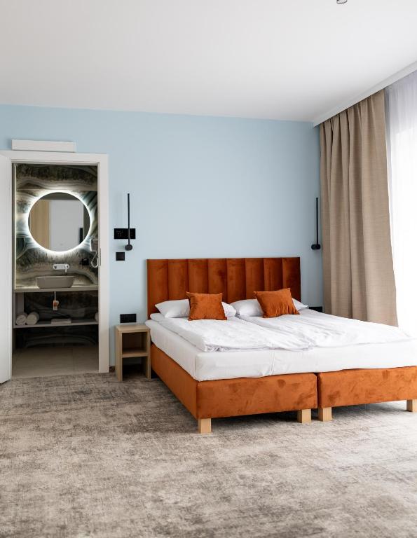 Postel nebo postele na pokoji v ubytování Plaża Resort Łeba & Wellness