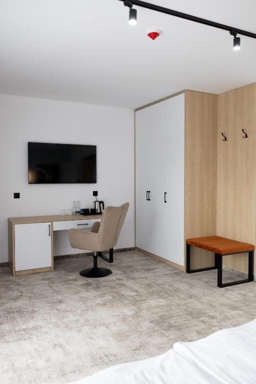 TV a/nebo společenská místnost v ubytování Plaża Resort Łeba & Wellness