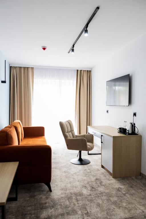 TV a/nebo společenská místnost v ubytování Plaża Resort Łeba & Wellness
