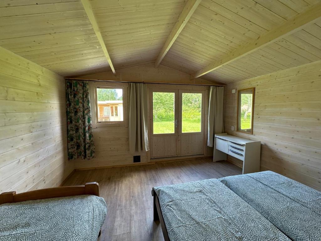 Postel nebo postele na pokoji v ubytování Kuriste camping