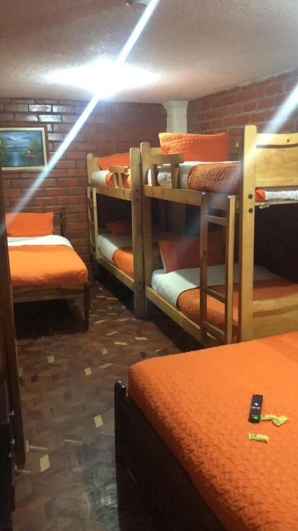 Postel nebo postele na pokoji v ubytování Hostal Nomada