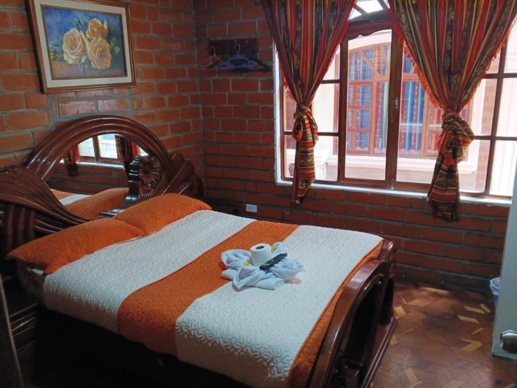 Postel nebo postele na pokoji v ubytování Hostal Nomada