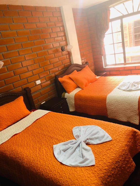 Postel nebo postele na pokoji v ubytování Hostal Nomada