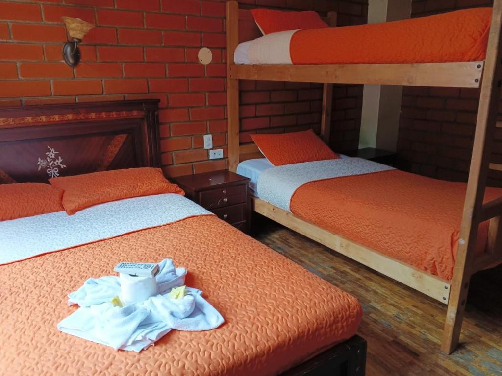 Postel nebo postele na pokoji v ubytování Hostal Nomada