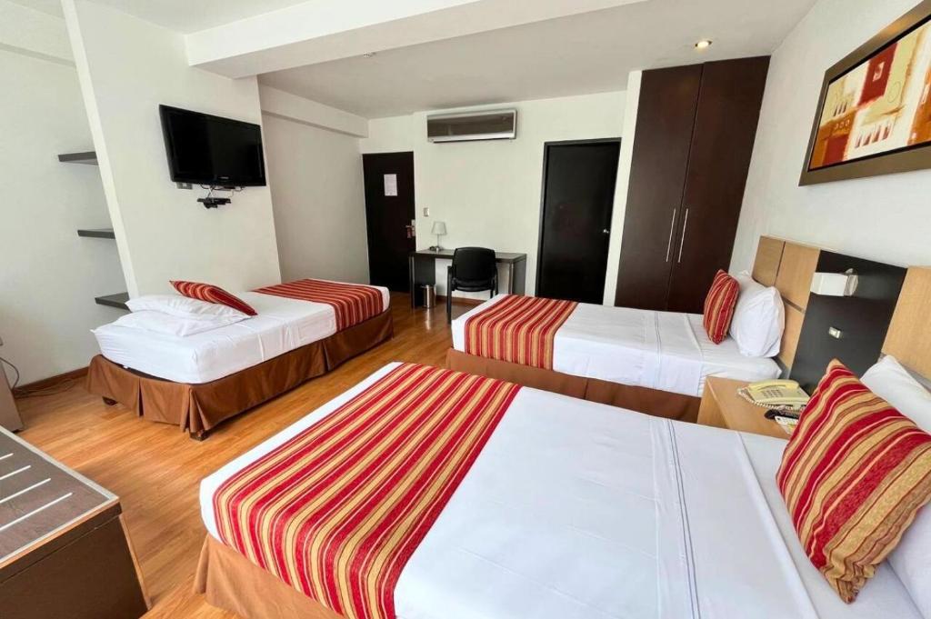 Cama o camas de una habitación en Allpa Hotel & Suites