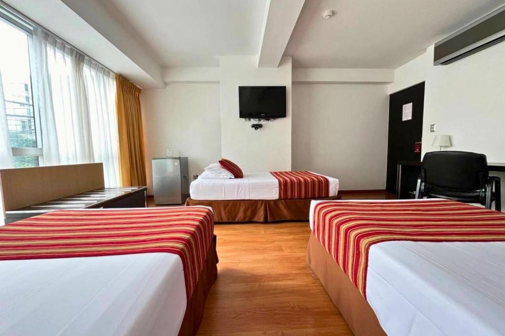 Cama o camas de una habitación en Allpa Hotel & Suites