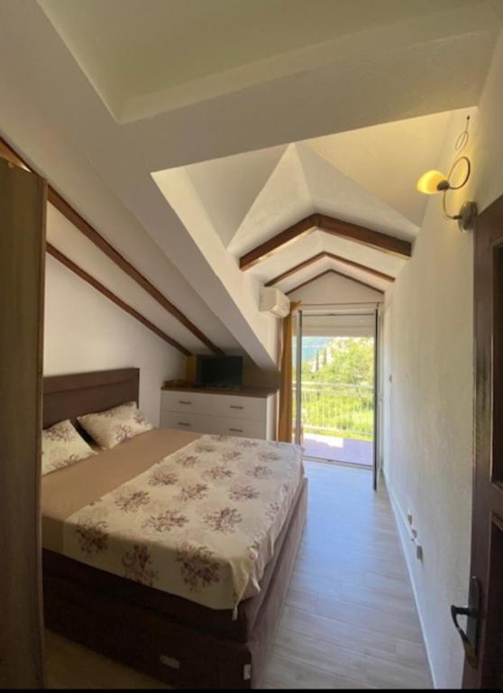 a bedroom with a large bed in a room at Lux apartmani Darija in Kotor