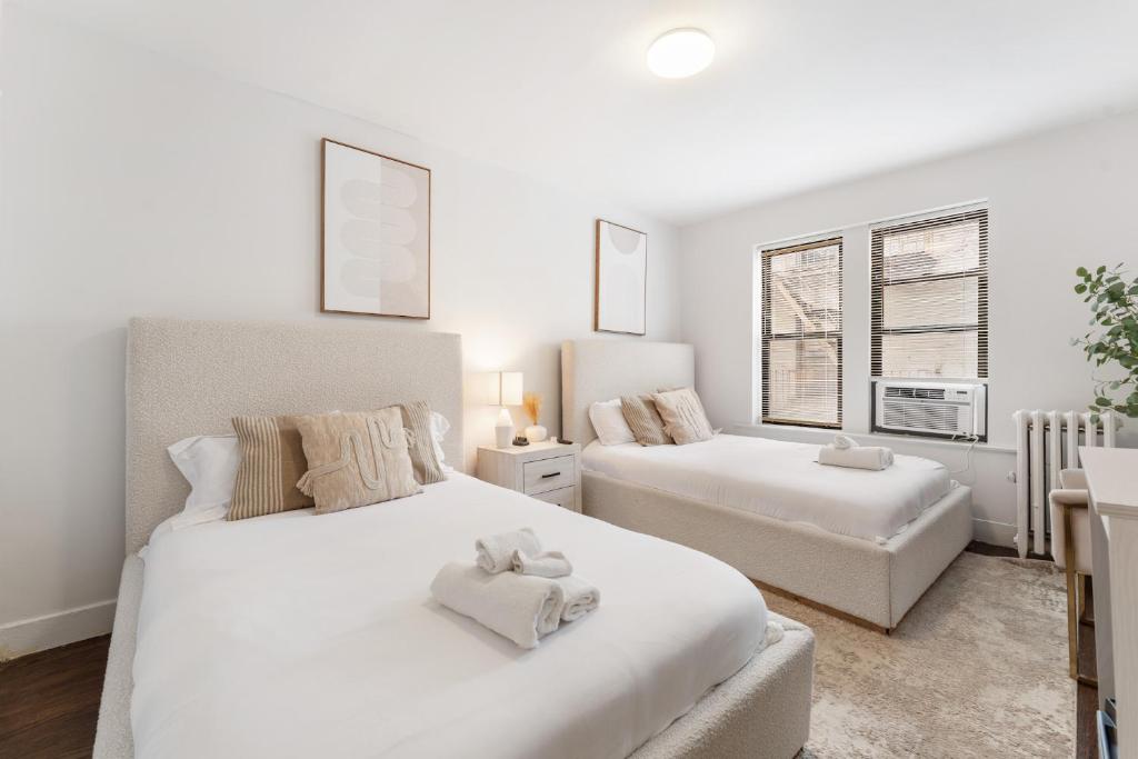 Postel nebo postele na pokoji v ubytování Bay Ridge ApartHotel