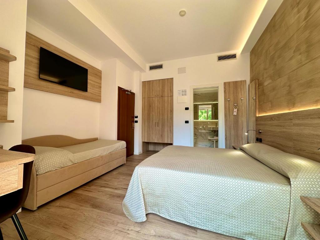 Postel nebo postele na pokoji v ubytování Hotel Beau Rivage Pineta