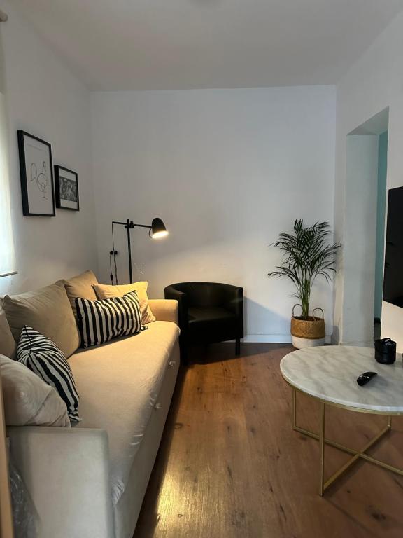 a living room with a couch and a table at Casa Leo in Almería