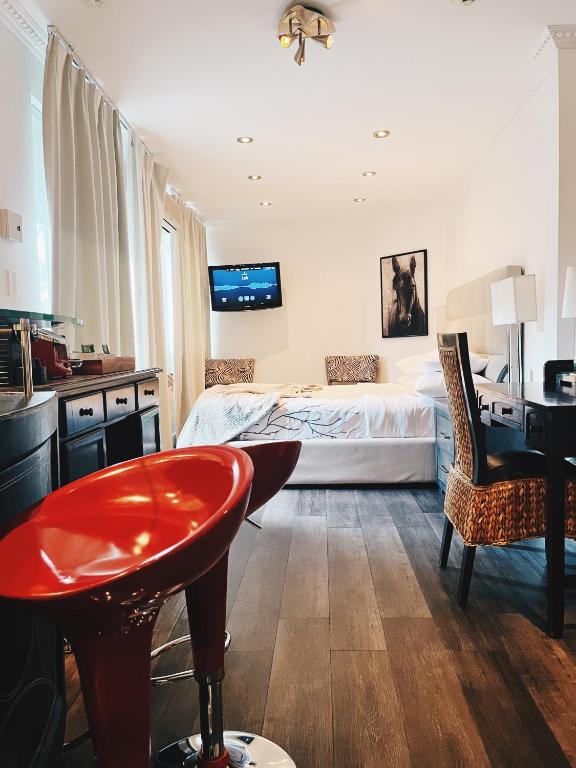 Postel nebo postele na pokoji v ubytování Hotel Kutuma