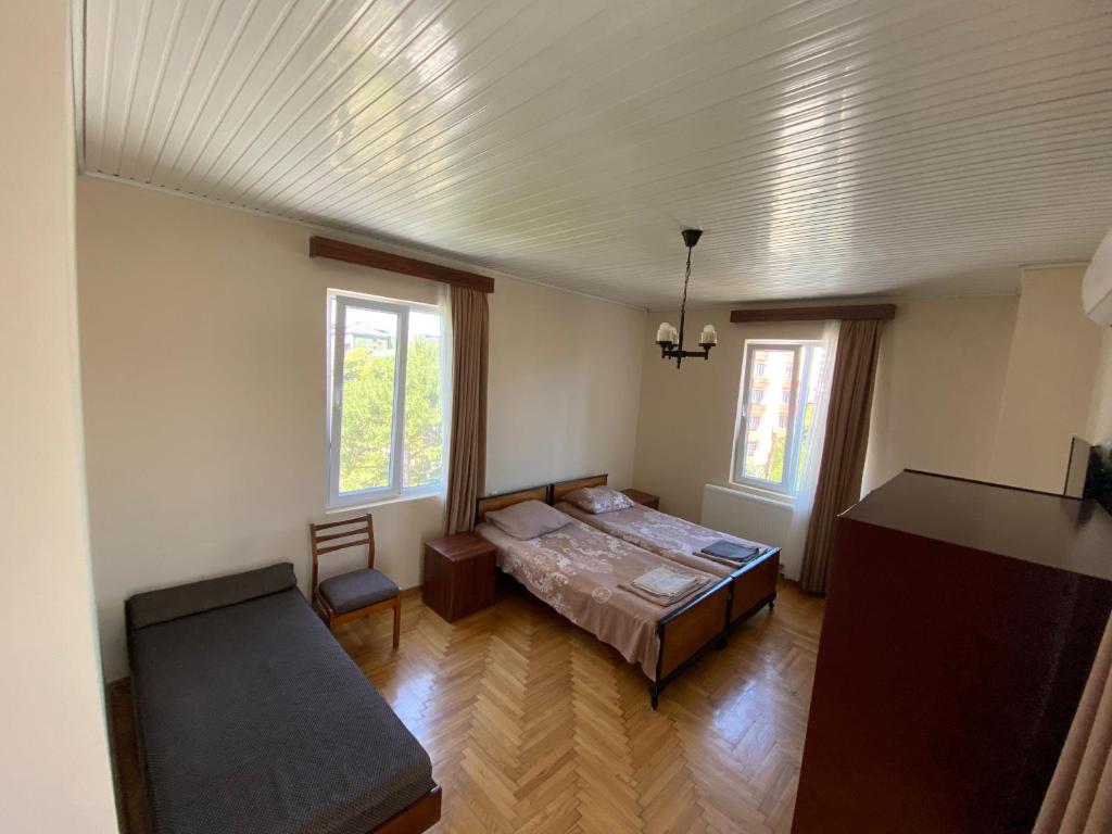 Postel nebo postele na pokoji v ubytování Guesthouse White Swan