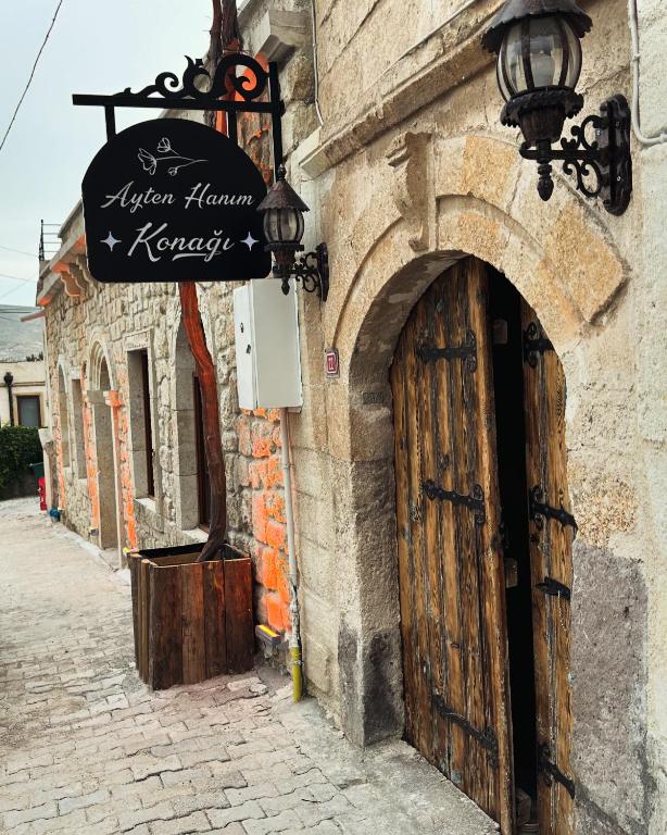 an entrance to a building with a wooden door at Ayten Hanım Konağı in Ürgüp