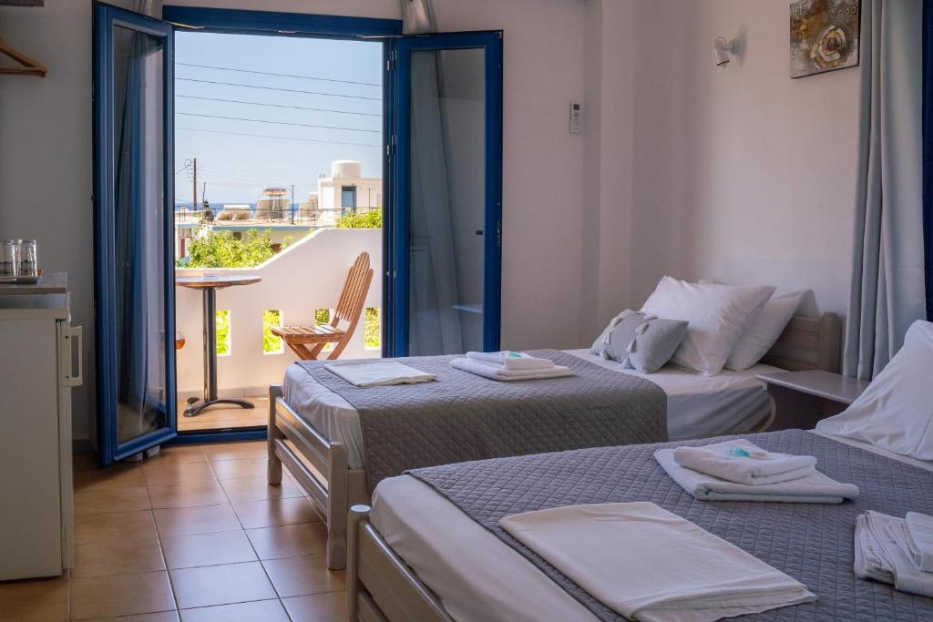 Postel nebo postele na pokoji v ubytování Giannis Rooms