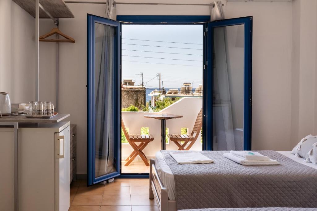 Postel nebo postele na pokoji v ubytování Giannis Rooms