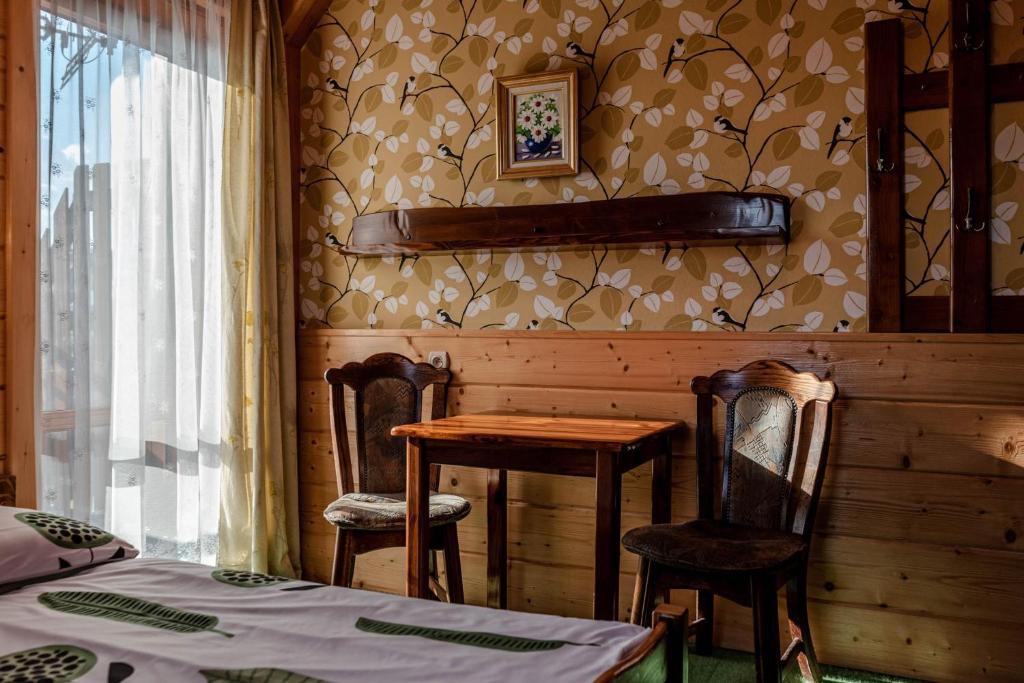 Posteľ alebo postele v izbe v ubytovaní Willa Jaroszówka