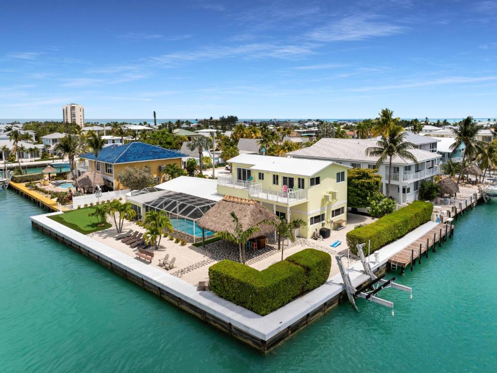 an aerial view of a house on a dock in the water at Manatee Bay in Key Colony Beach