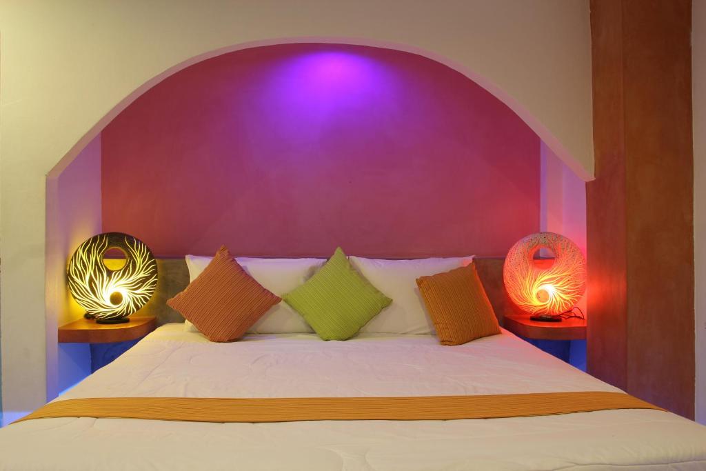 Postel nebo postele na pokoji v ubytování Pandora By Jida Lifestyle Hotel