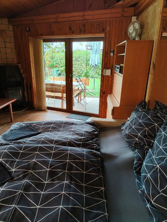Postel nebo postele na pokoji v ubytování Kranio