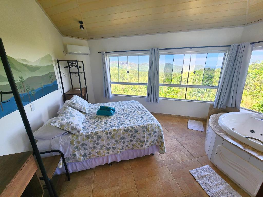 Postel nebo postele na pokoji v ubytování Bangalô São Jorge - Ecohospedagem Canto da Coruja