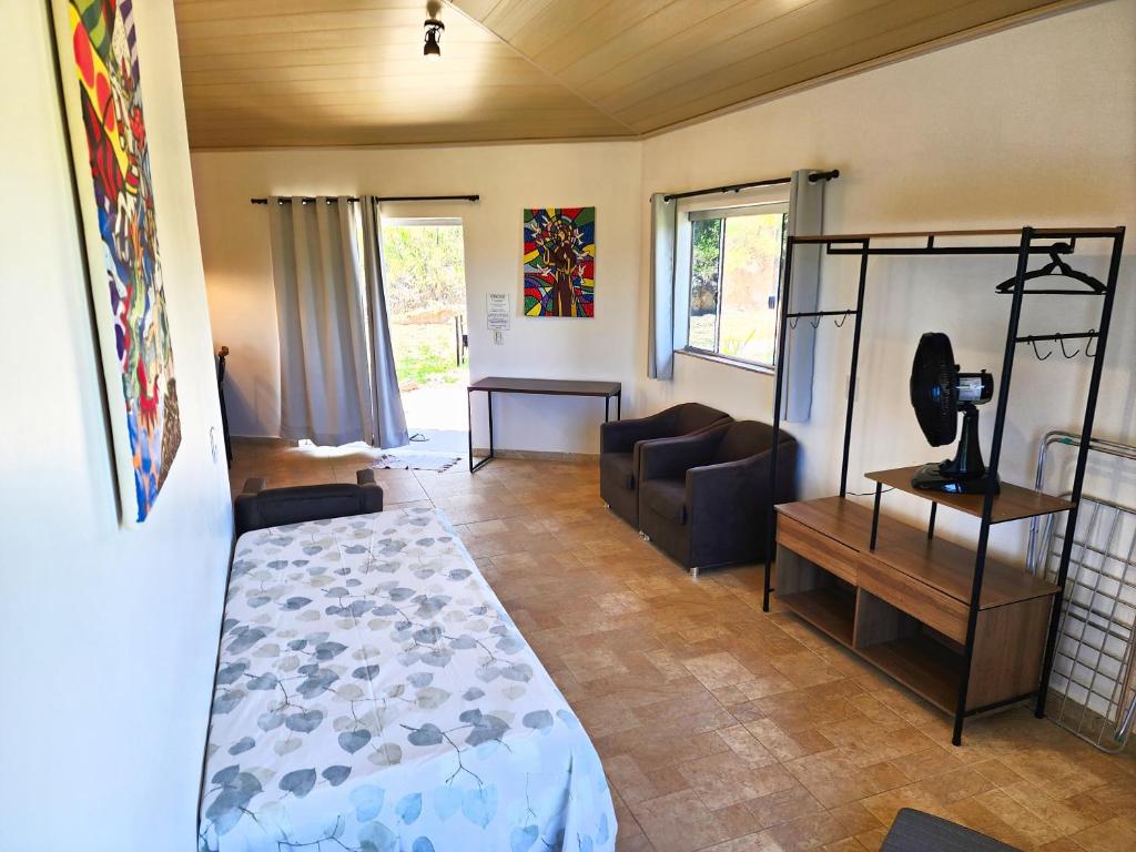 Postel nebo postele na pokoji v ubytování Bangalô São Jorge - Ecohospedagem Canto da Coruja