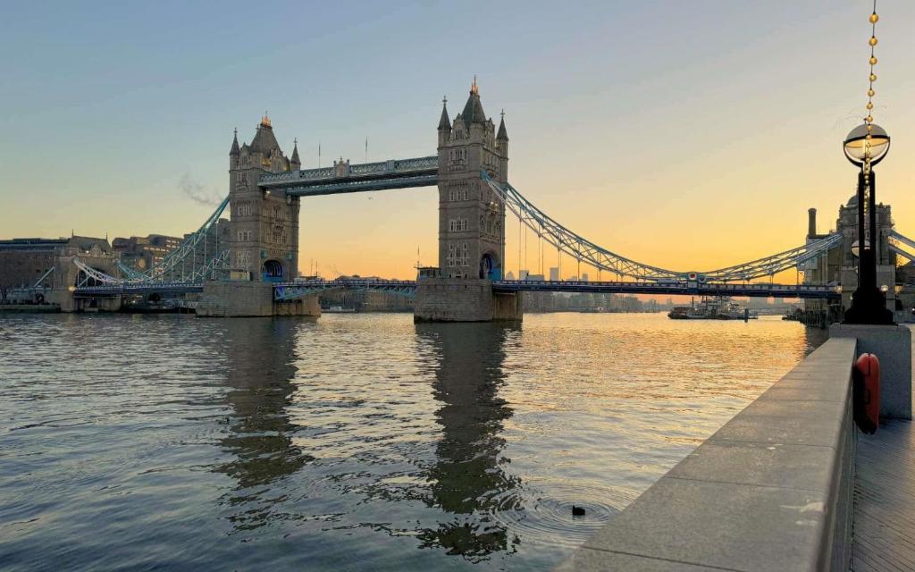 a bridge over the water with the tower of london at Studio Apartment (St Katherine’s and Wapping) in London