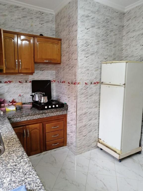 Kuchyň nebo kuchyňský kout v ubytování إقامة بدر