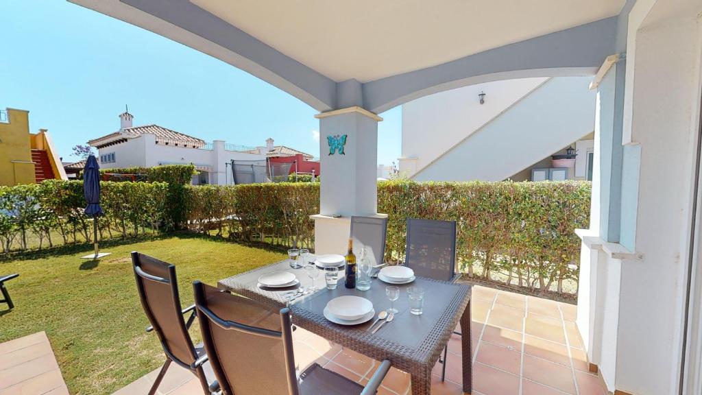 a table and chairs on the patio of a house at Villa Azul Mar Menor in Torre-Pacheco