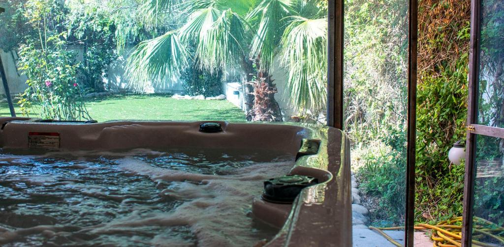 a bath tub with water coming out of it at Villa Balluta in St Julian's