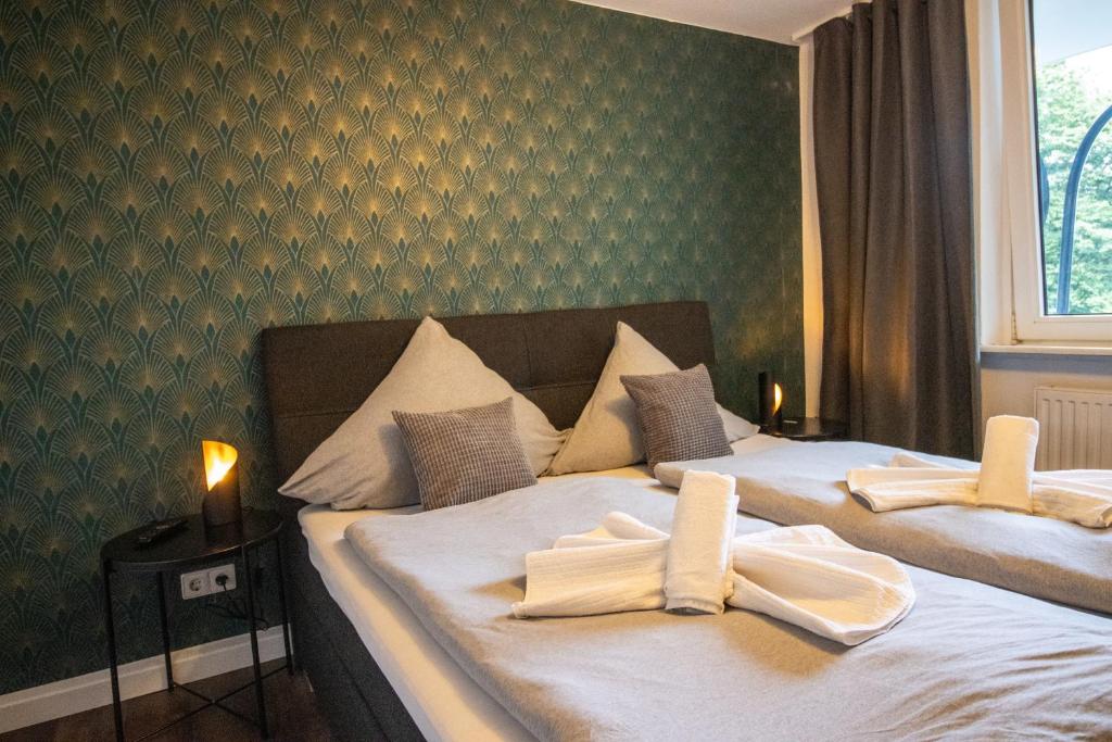 Postel nebo postele na pokoji v ubytování Messewohnung für 5 Gäste mit Balkon und Lift