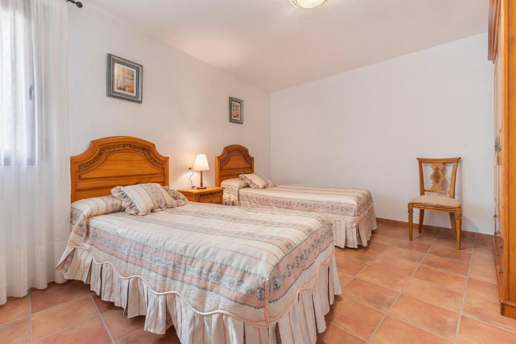Postel nebo postele na pokoji v ubytování Casa Fuster