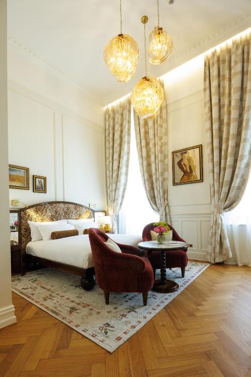 Postel nebo postele na pokoji v ubytování Hotel Fleur de Ville