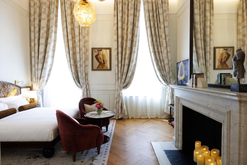 Postel nebo postele na pokoji v ubytování Hotel Fleur de Ville