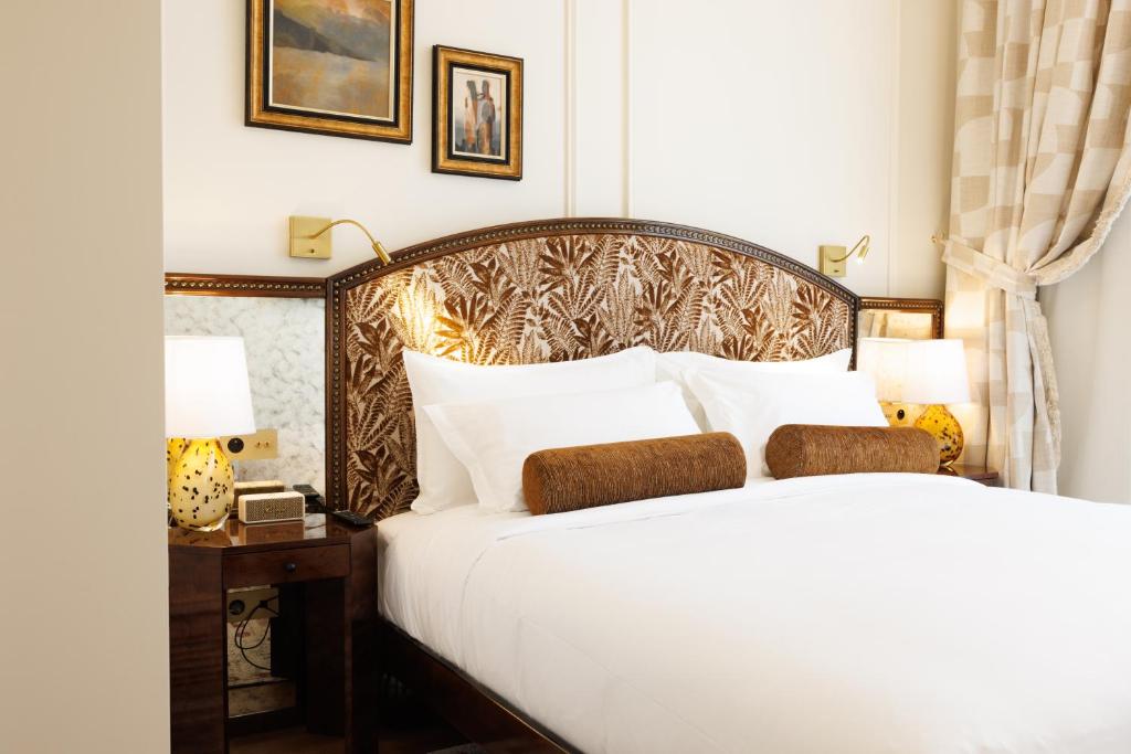 Postel nebo postele na pokoji v ubytování Hotel Fleur de Ville