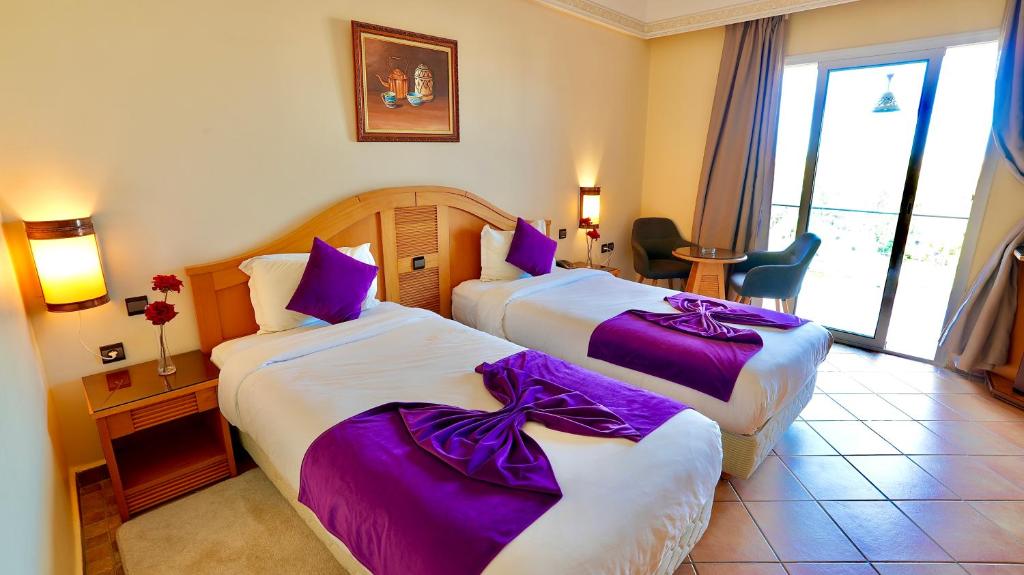 Postel nebo postele na pokoji v ubytování Hotel Menzeh Dalia