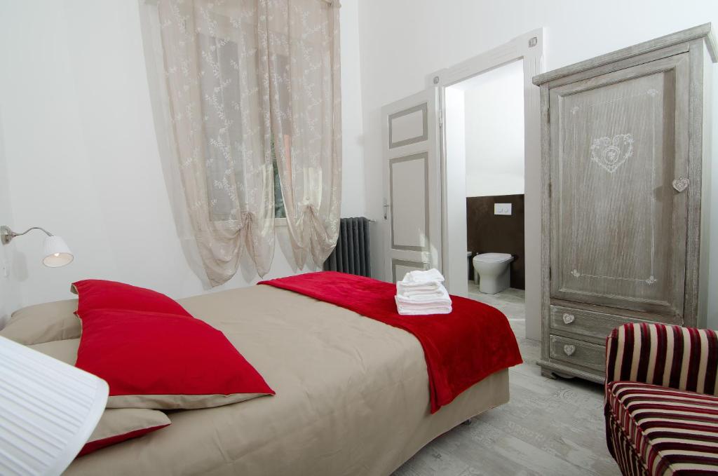 מיטה או מיטות בחדר ב-A Casa di Lu Na