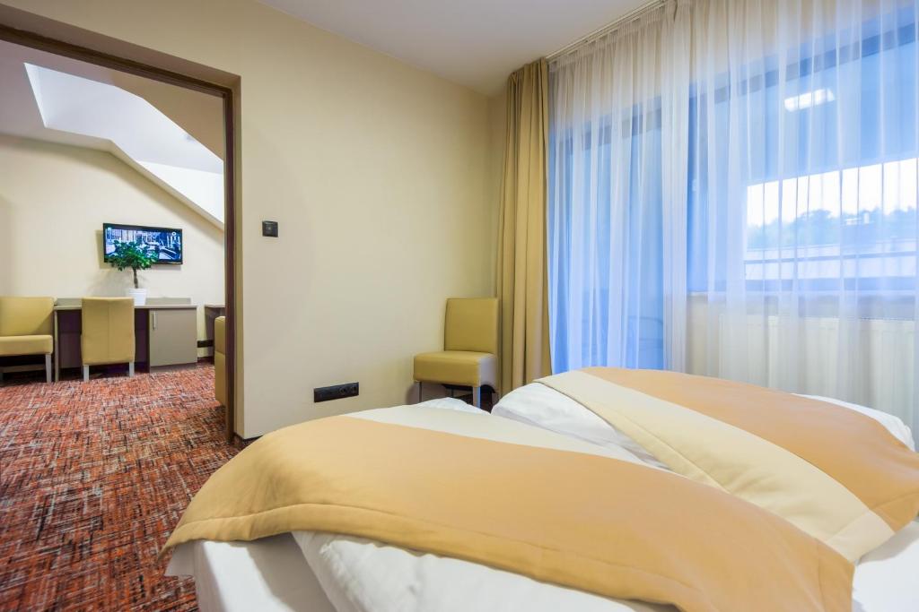 Postel nebo postele na pokoji v ubytování Pensjonat Kanion