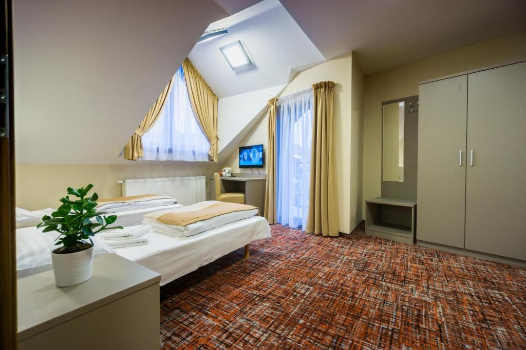 Postel nebo postele na pokoji v ubytování Pensjonat Kanion