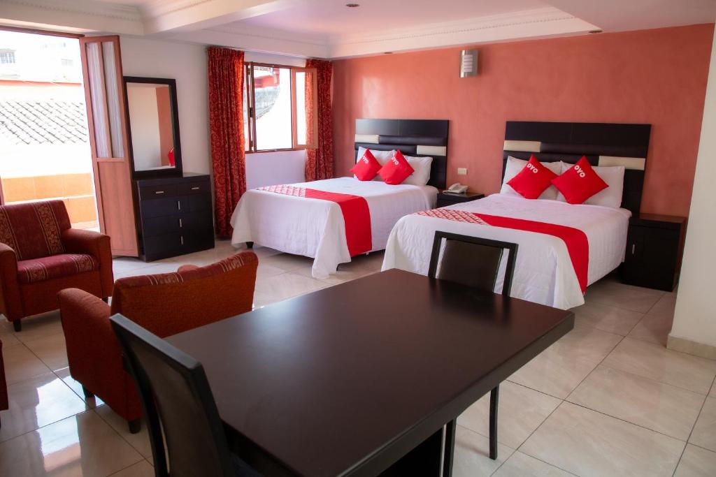 Postel nebo postele na pokoji v ubytování Hotel Posada Del Parque