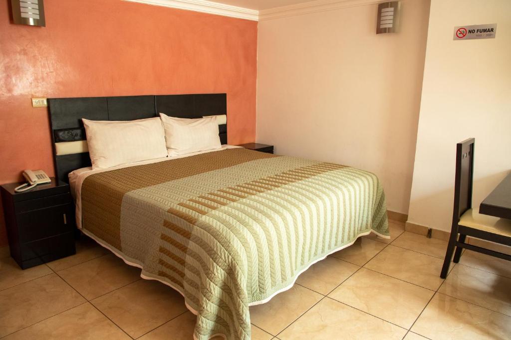 Postel nebo postele na pokoji v ubytování Hotel Posada Del Parque