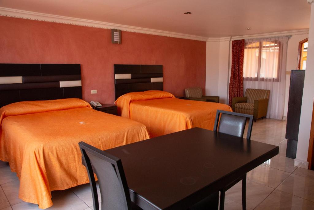 Postel nebo postele na pokoji v ubytování Hotel Posada Del Parque