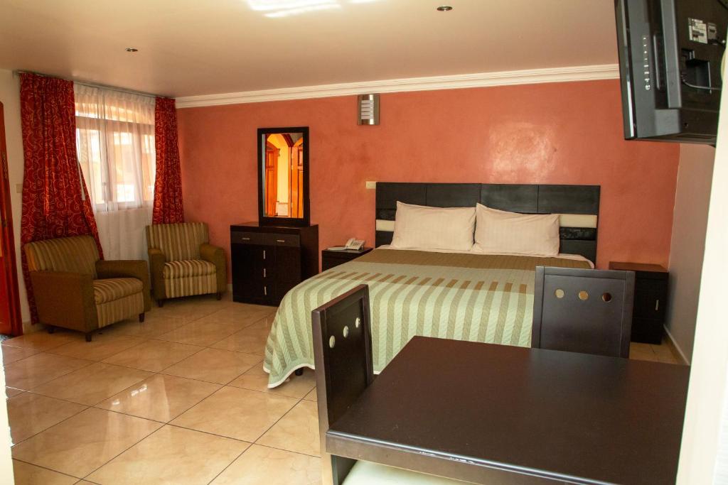Postel nebo postele na pokoji v ubytování Hotel Posada Del Parque